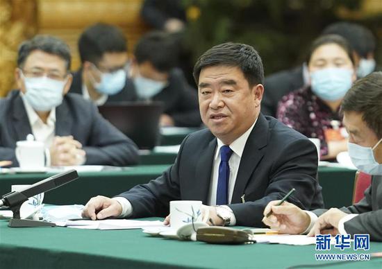 5月22日，全國人大代表薛志國參加內(nèi)蒙古代表團的審議并發(fā)言。新華社記者 黃敬文 攝